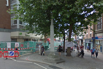 The cross, half-hidden by the tree, marks the spot where Harry Hotspur's body was placed*