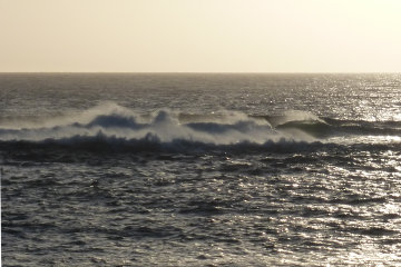 The setting sun caught the waves as they marched into Borve.*