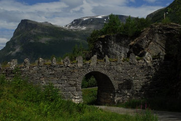 Go <i>through</i> the arch to come out <i>on top of</i> the arch!*